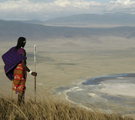 Ngorongoro crater rim with Maasai looking into crater basin dry season